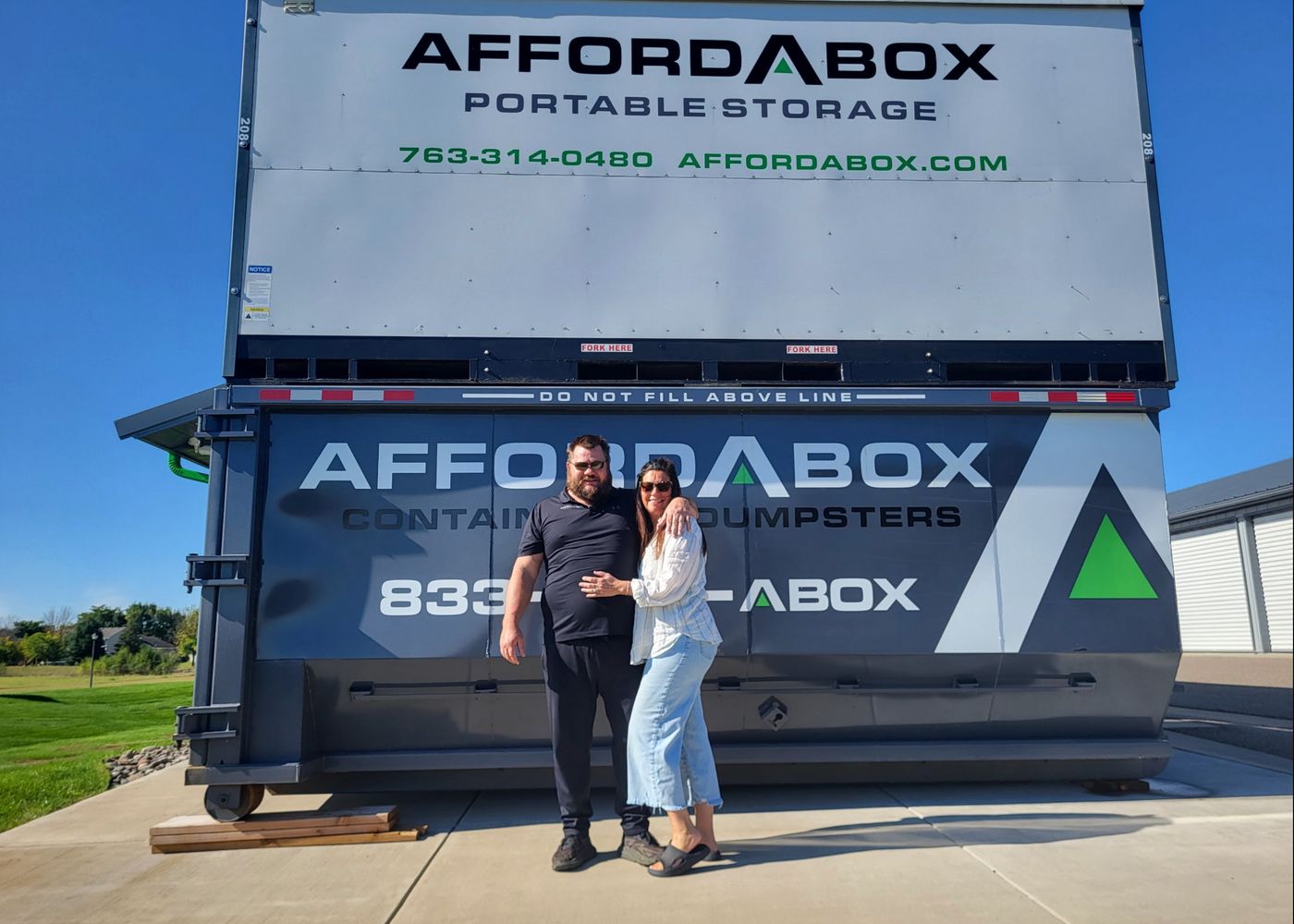 Happy AffordABox customers with their portable storage unit