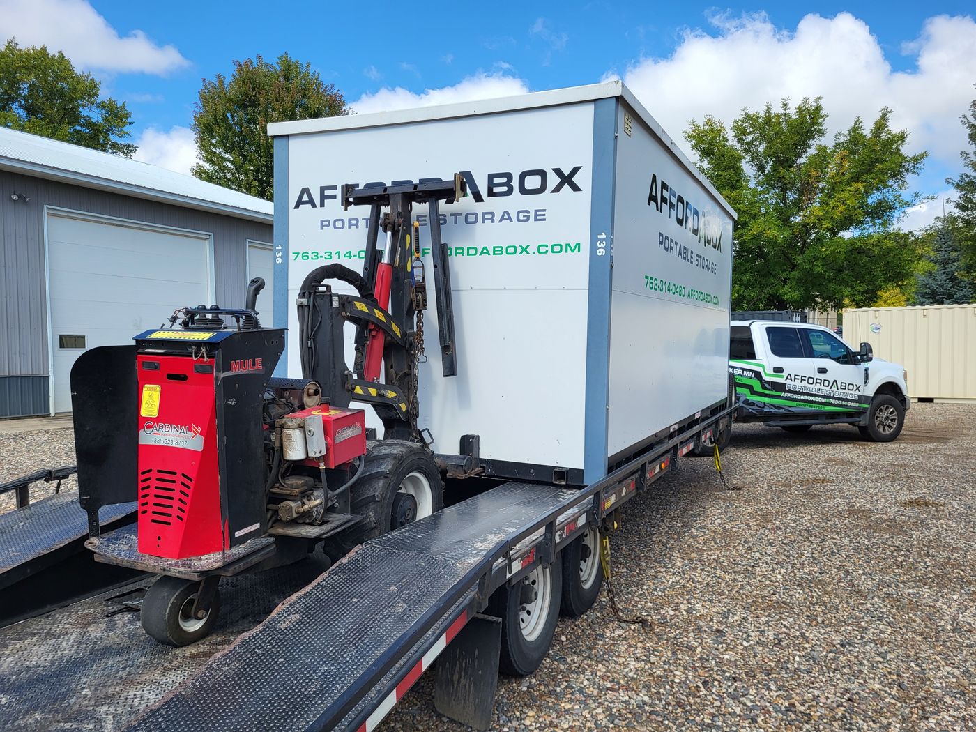 The AffordABox Mule remote-control system delivering a portable storage unit on a trailer
