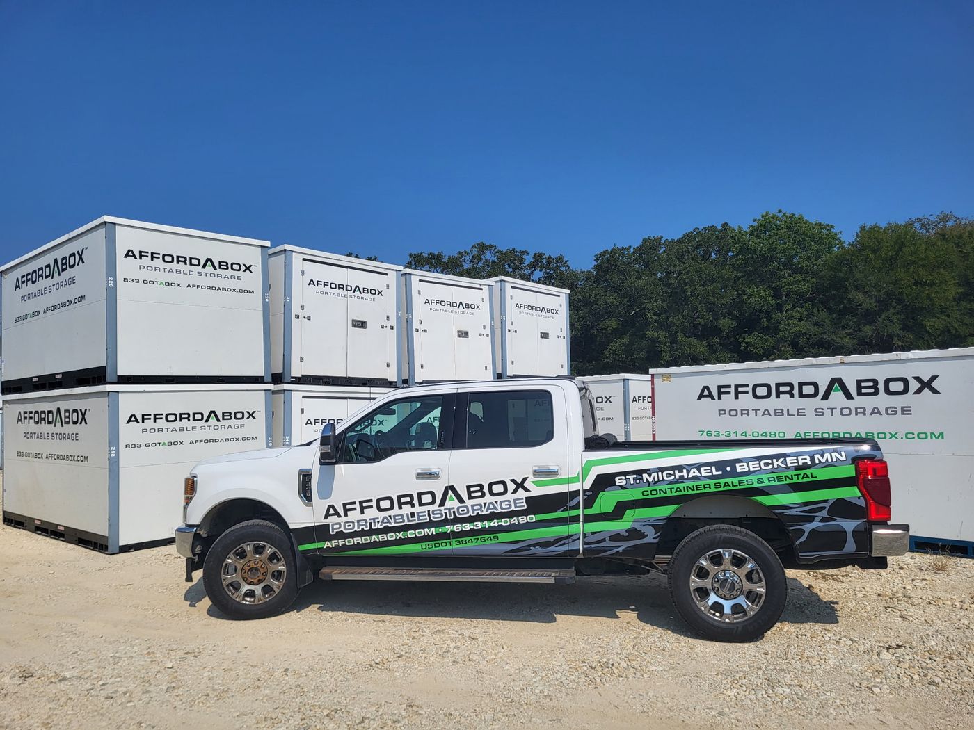AffordABox portable storage units and truck